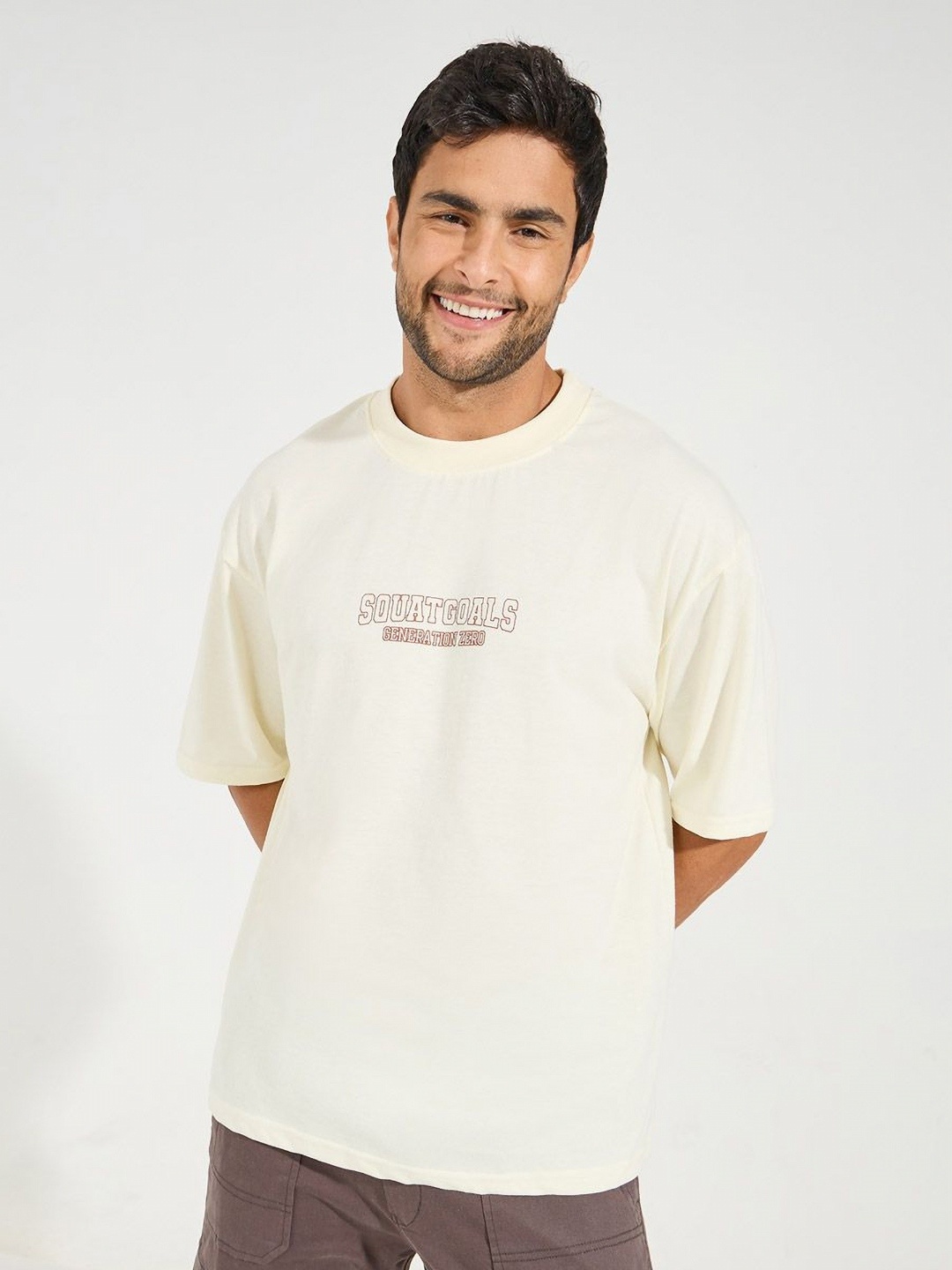 

Styli Men Cotton Rich Chest Printed Oversized Athleisure Tee with Mock Neck Detail, Cream