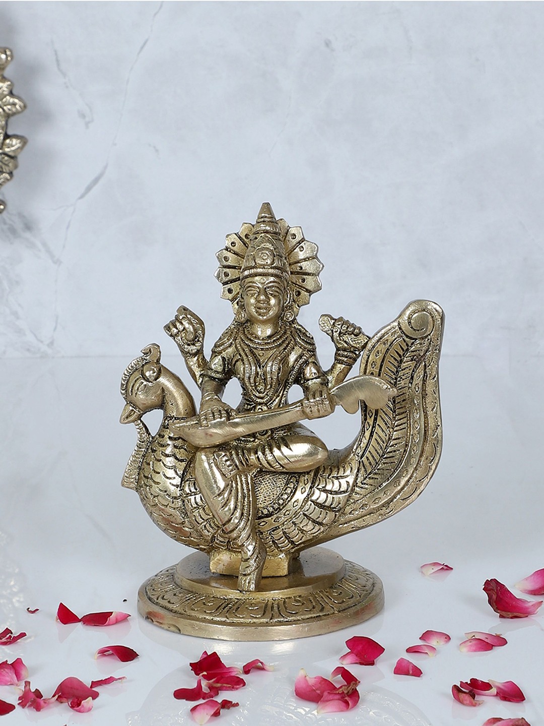 

Two Moustaches Gold-Toned Small Saraswati on Swan Brass Religious Idol Showpiece