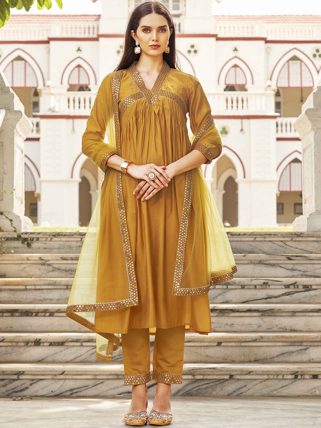 

Tikhi Imli Geometric Yoke Design Empire Mirror Work A-Line Kurta with Trousers & Dupatta, Mustard