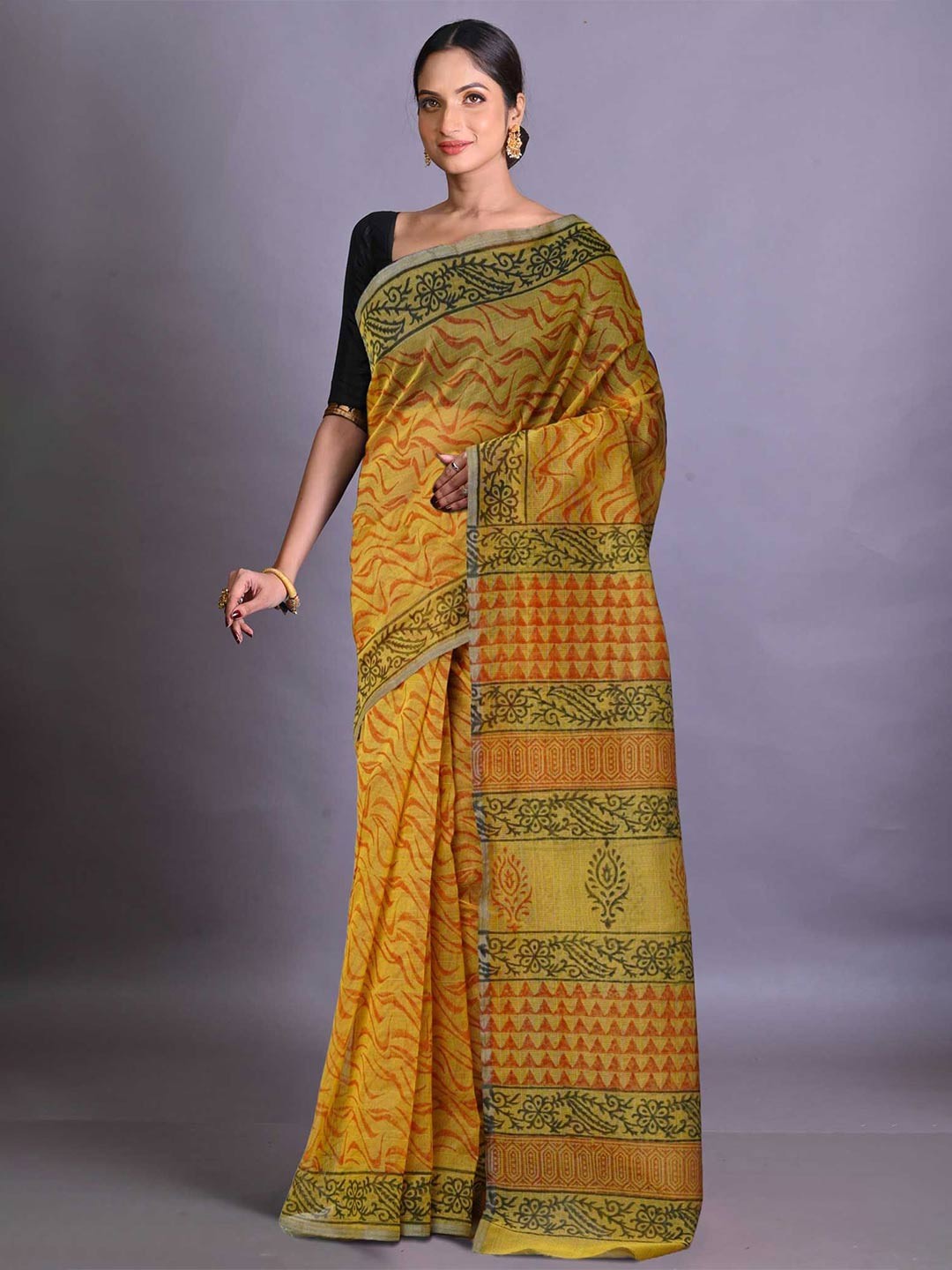 

Unnati Silks Ethnic Motifs Supernet Handloom Block Print Saree, Yellow