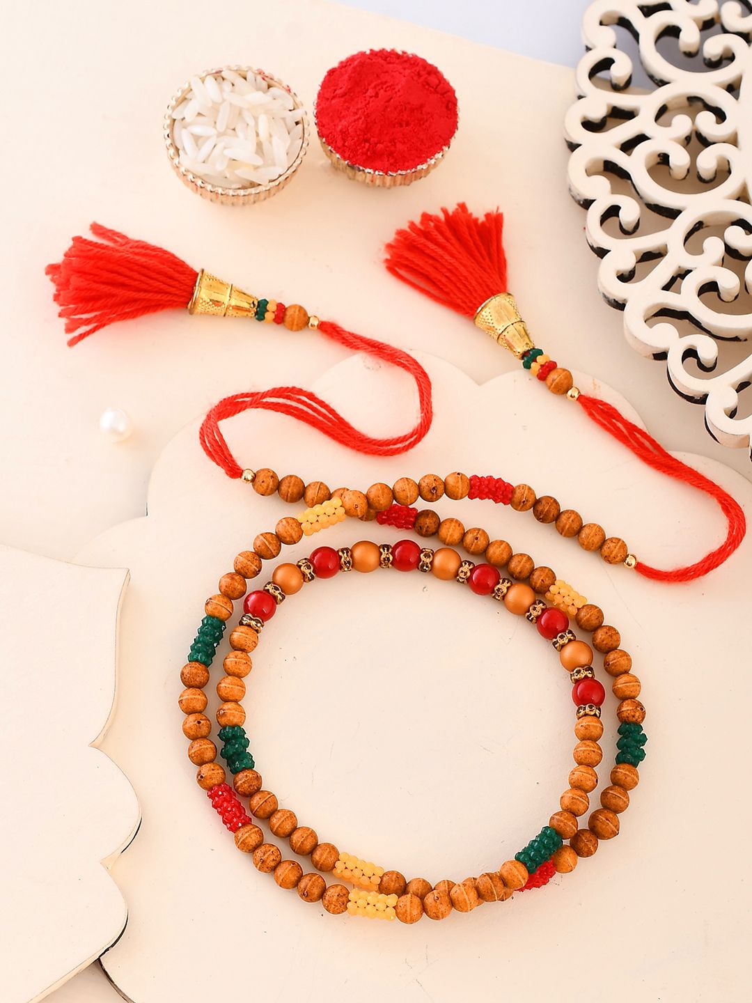 

Anouk Red Stone Studded & Beaded Thread Rakhi With Roli Chawal With Greeting Card, Brown