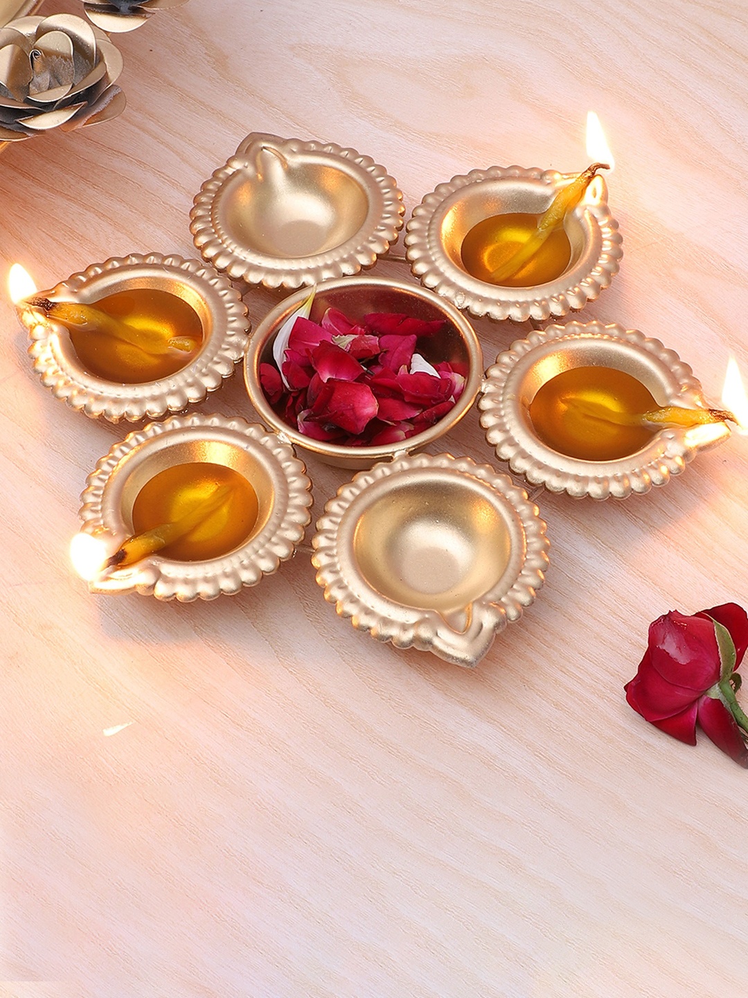 

Two Moustaches Gold Toned Diya Shape Decorative Urli Bowl