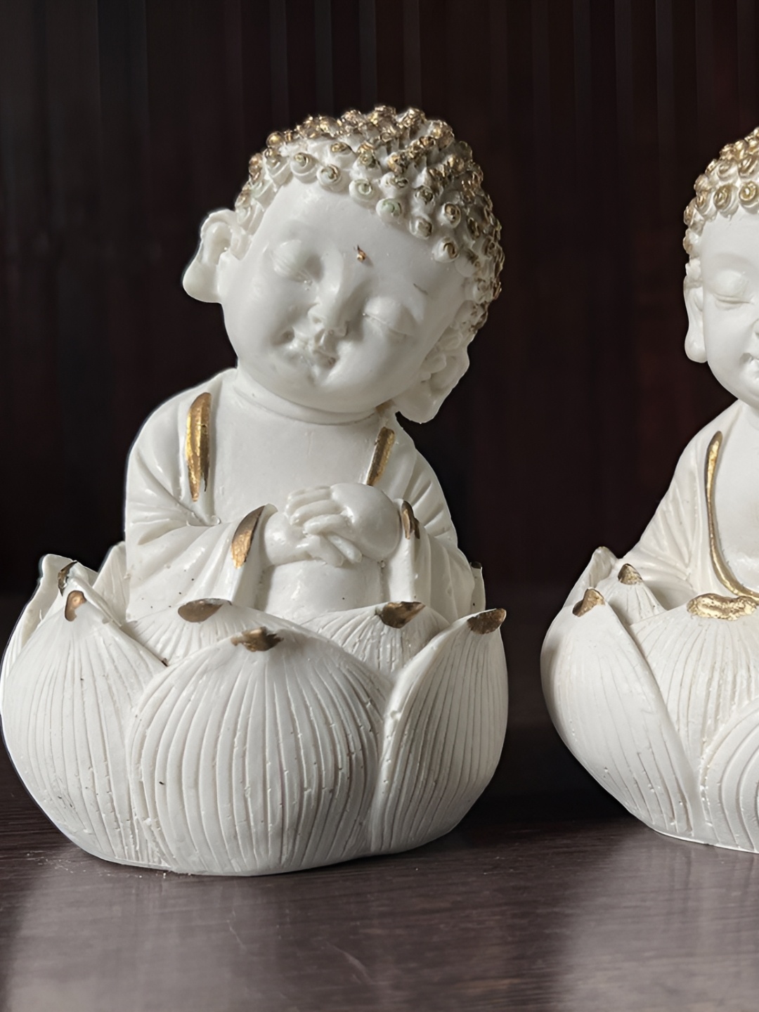 

Vikarafty White & Gold Toned 2 Pieces Textured Buddha Idol Showpieces