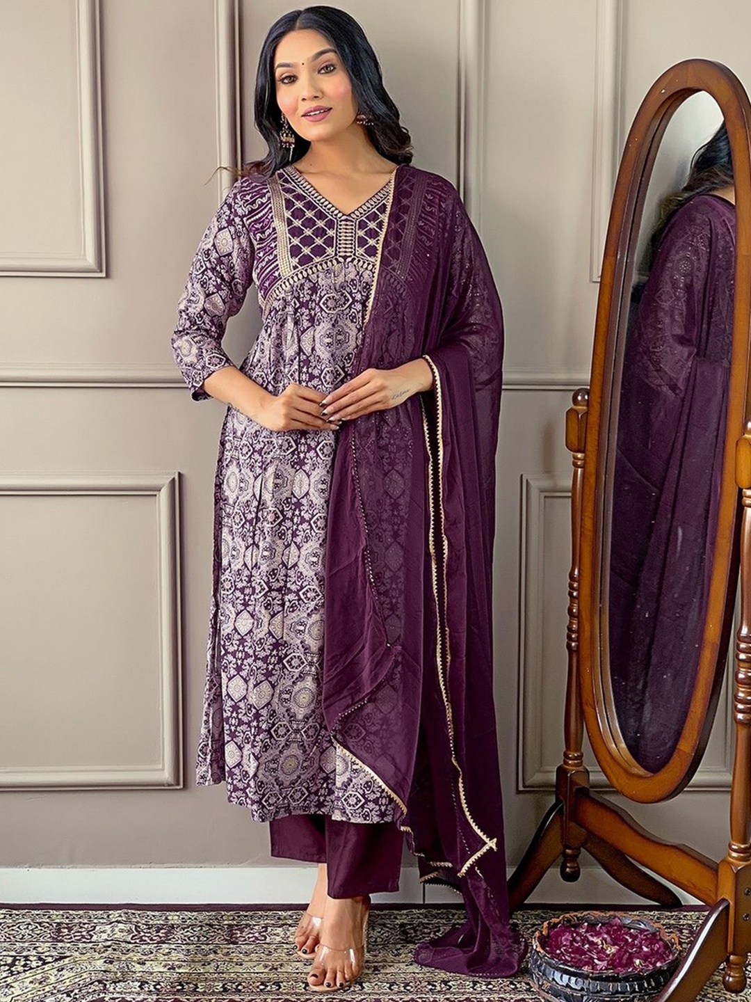 

Yara Creation Floral Printed Thread Work Empire A-Line Kurta With Trousers & Dupatta, Purple