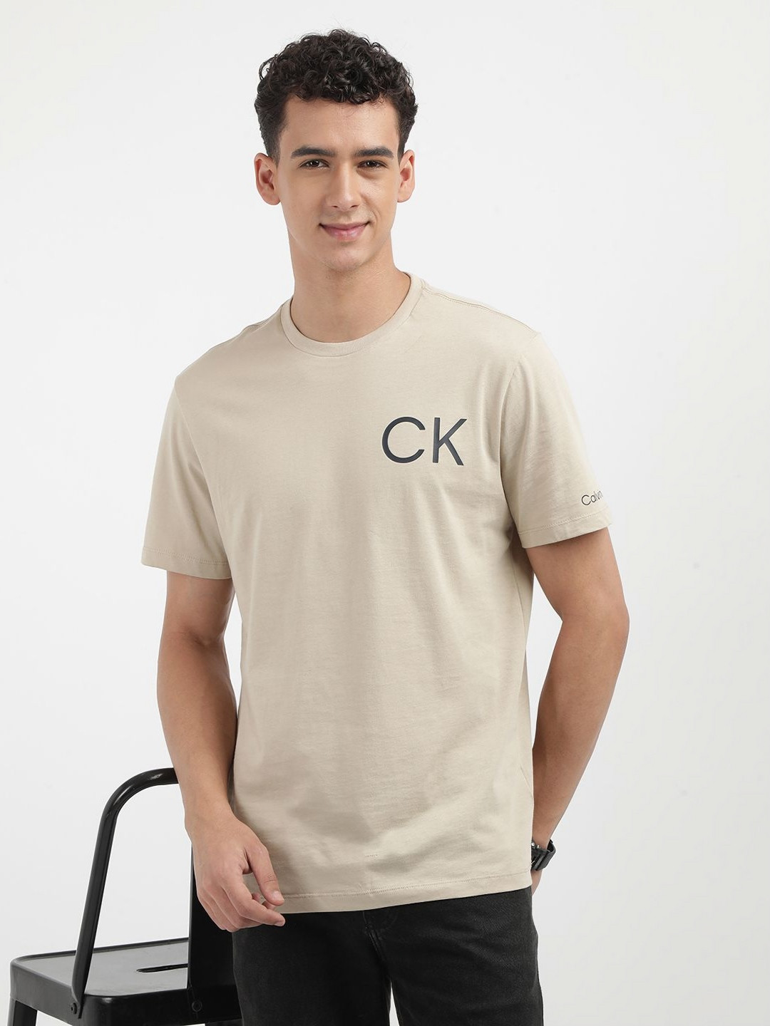 

Calvin Klein Jeans Men Solid Round Neck Cotton T-shirt, Beige