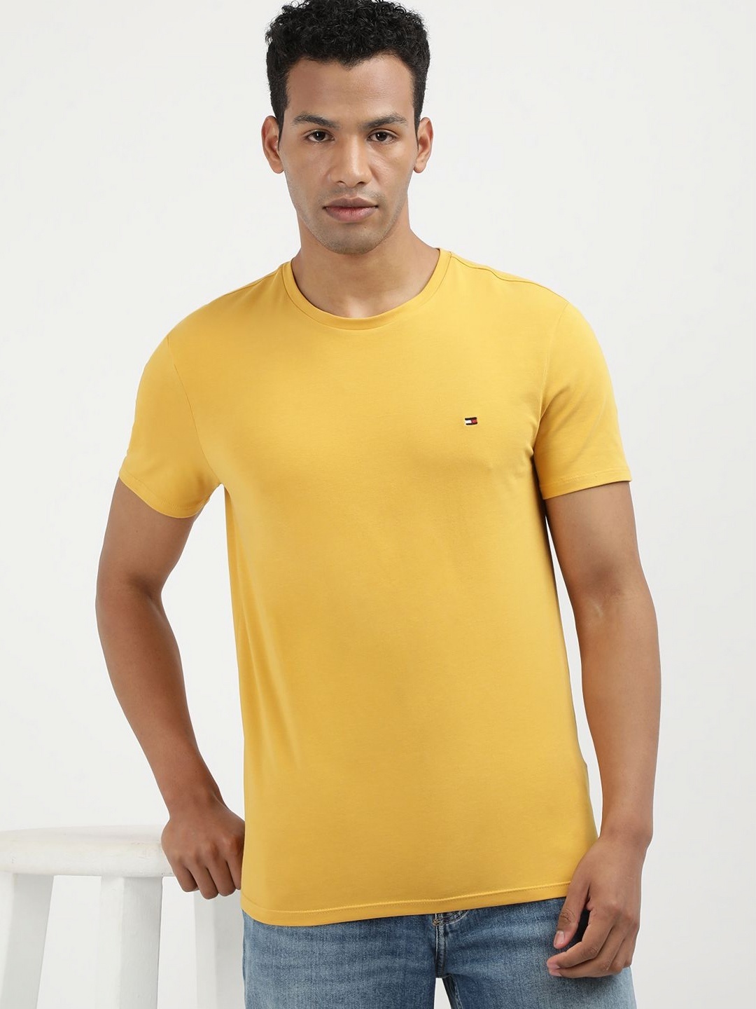 

Tommy Hilfiger Men Solid Round Neck Cotton Slim Fit T-shirt, Yellow