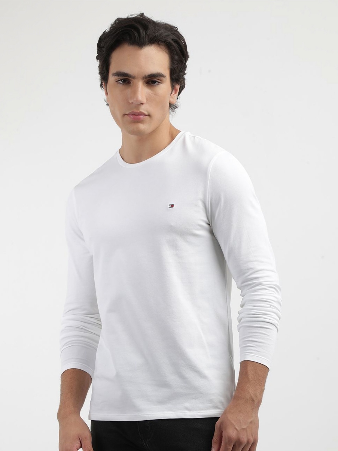 

Tommy Hilfiger Men Solid Round Neck Cotton Slim Fit T-shirt, White