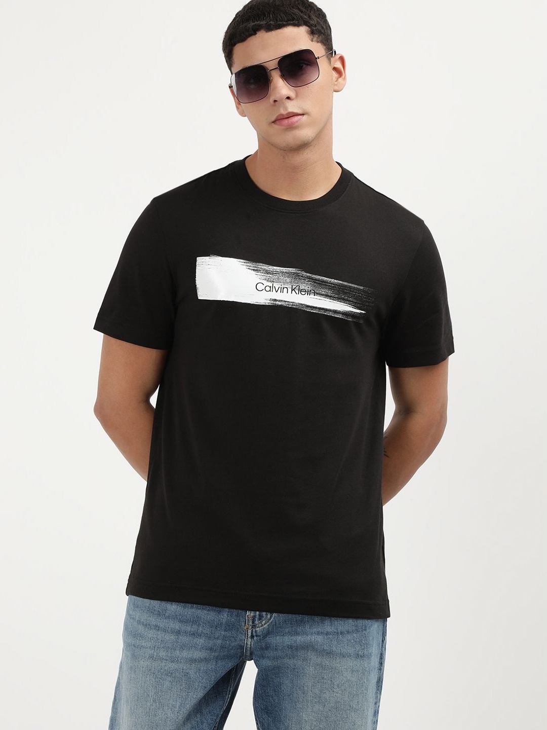 

Calvin Klein Jeans Men Graphic Printed Round Neck Cotton T-shirt, Black