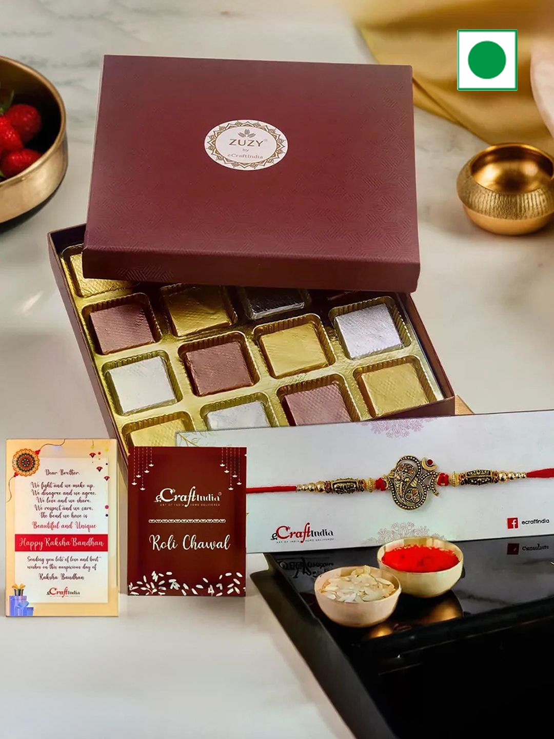 

eCraftIndia Om Rakhi With Zuzy Assorted Chocolate Gift Box 16 Pcs and Roli Chawal Pack, Maroon