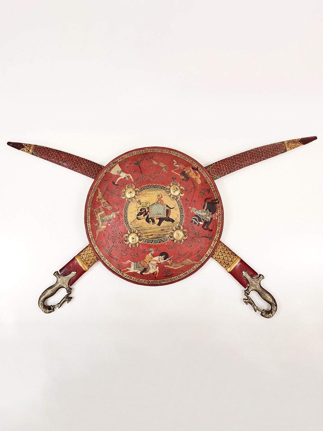 

Exotic India Orange & Green Printed Brass & Wooden Dhal Talwar Wall Hanging