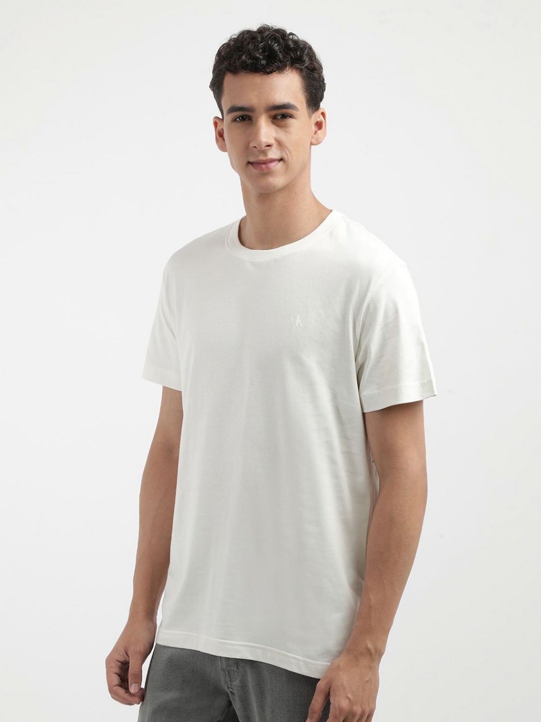 

Calvin Klein Jeans Men Typography Printed Round Neck Cotton T-shirt, Beige