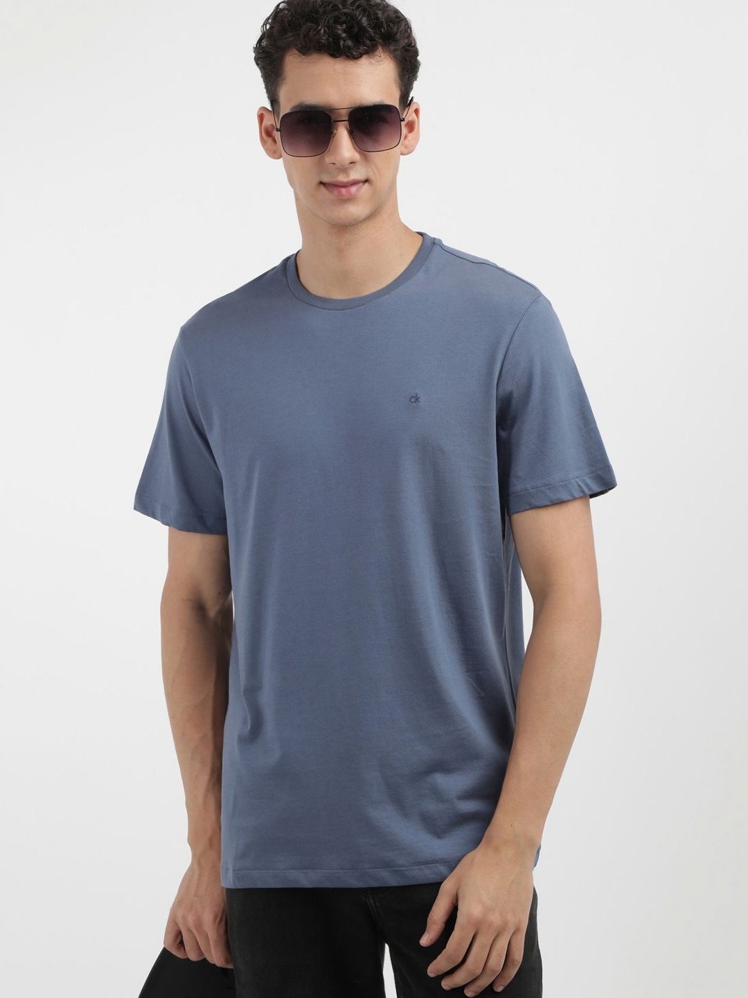

Calvin Klein Jeans Men Solid Round Neck Cotton T-shirt, Blue