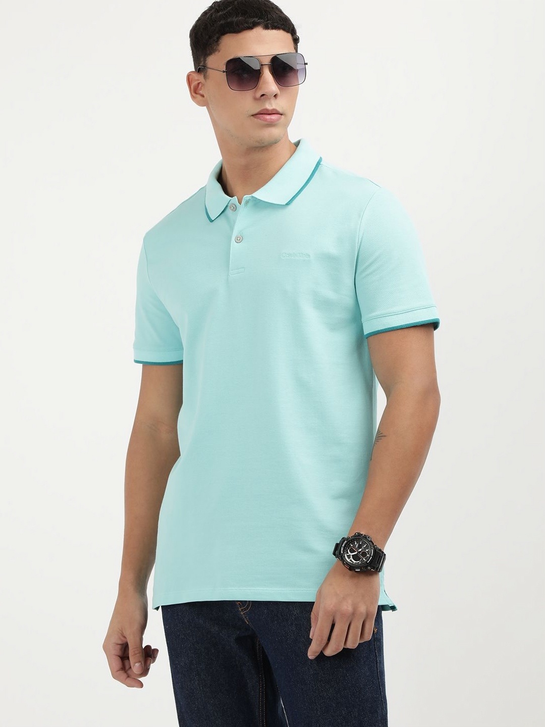 

Calvin Klein Jeans Men Solid Polo Collar Cotton T-shirt, Blue