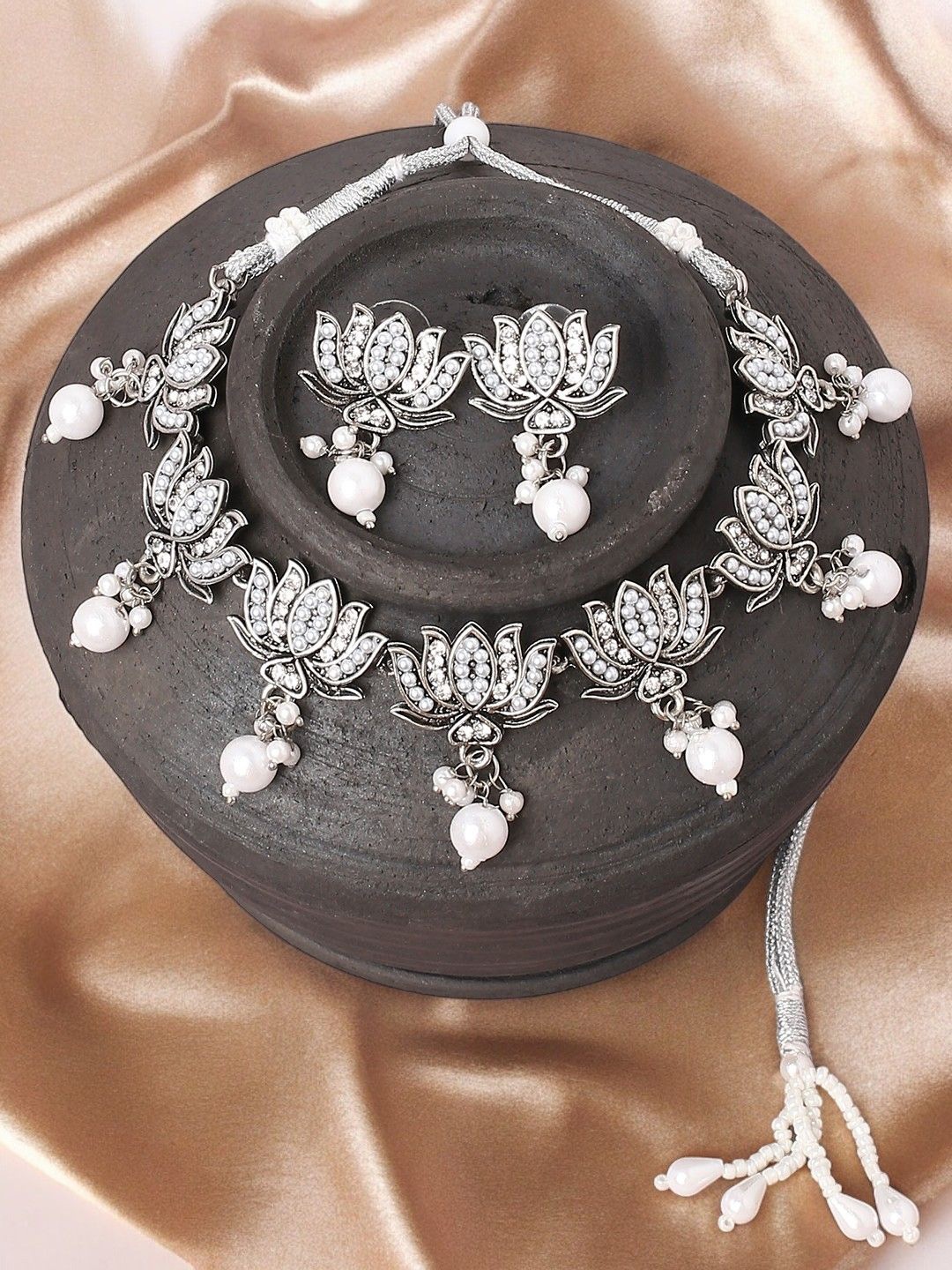 

Sangria Silver-Toned Stones Studded & Beaded Oxidised Lotus Jewellery Set