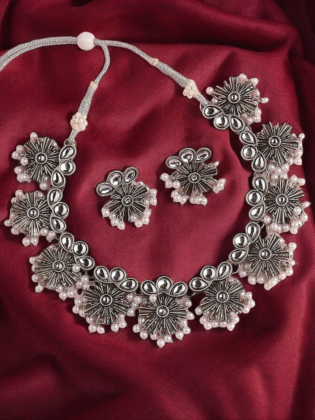 

Sangria Silver-Toned Kundan Stone-Studded & Beaded Oxidised Jewellery Set