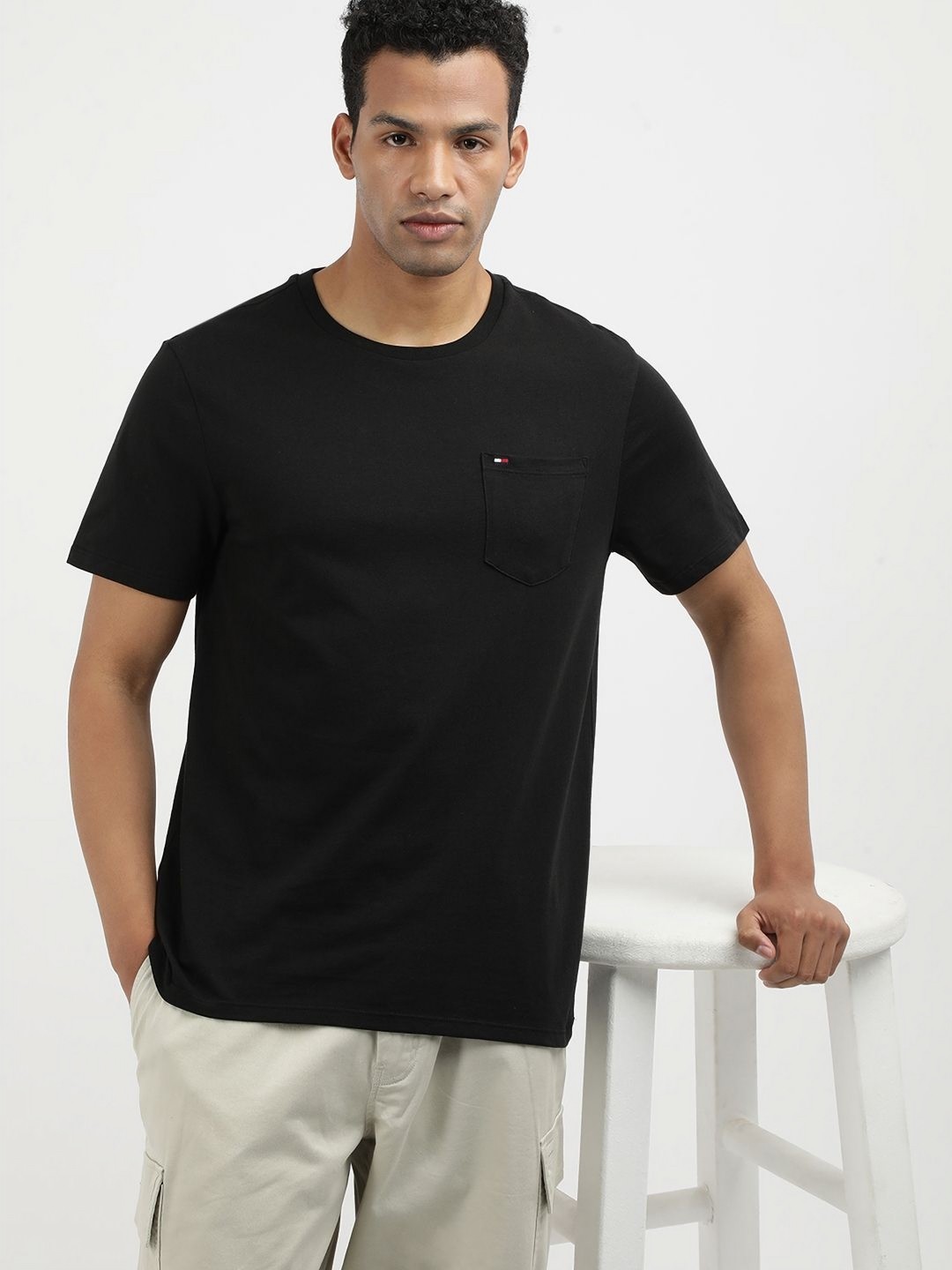 

Tommy Hilfiger Men Solid Round Neck Cotton T-shirt, Black