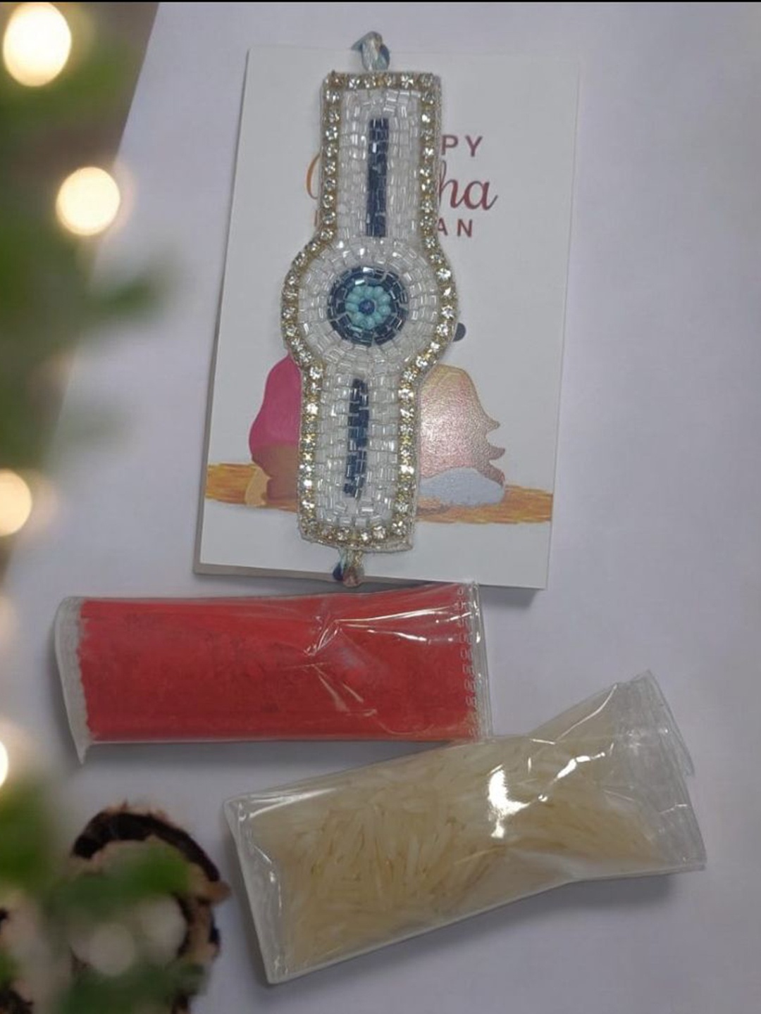 

PRIAANSHA CREATIONS Stone Studded & Beaded Thread Rakhi With Roli Chawal, White