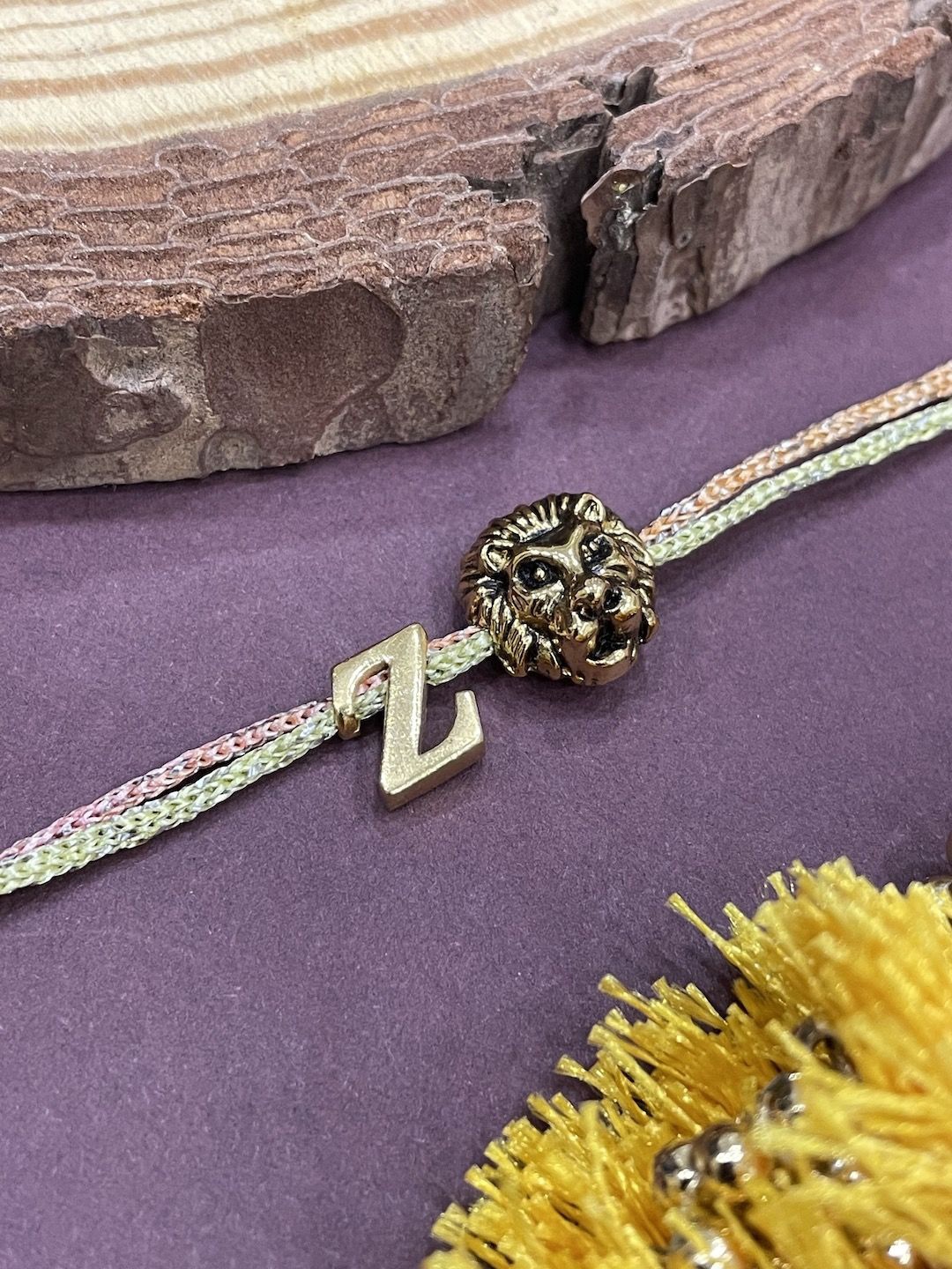 

Digital Dress Room Z Letter Lion Charm Thread Rakhi, Gold