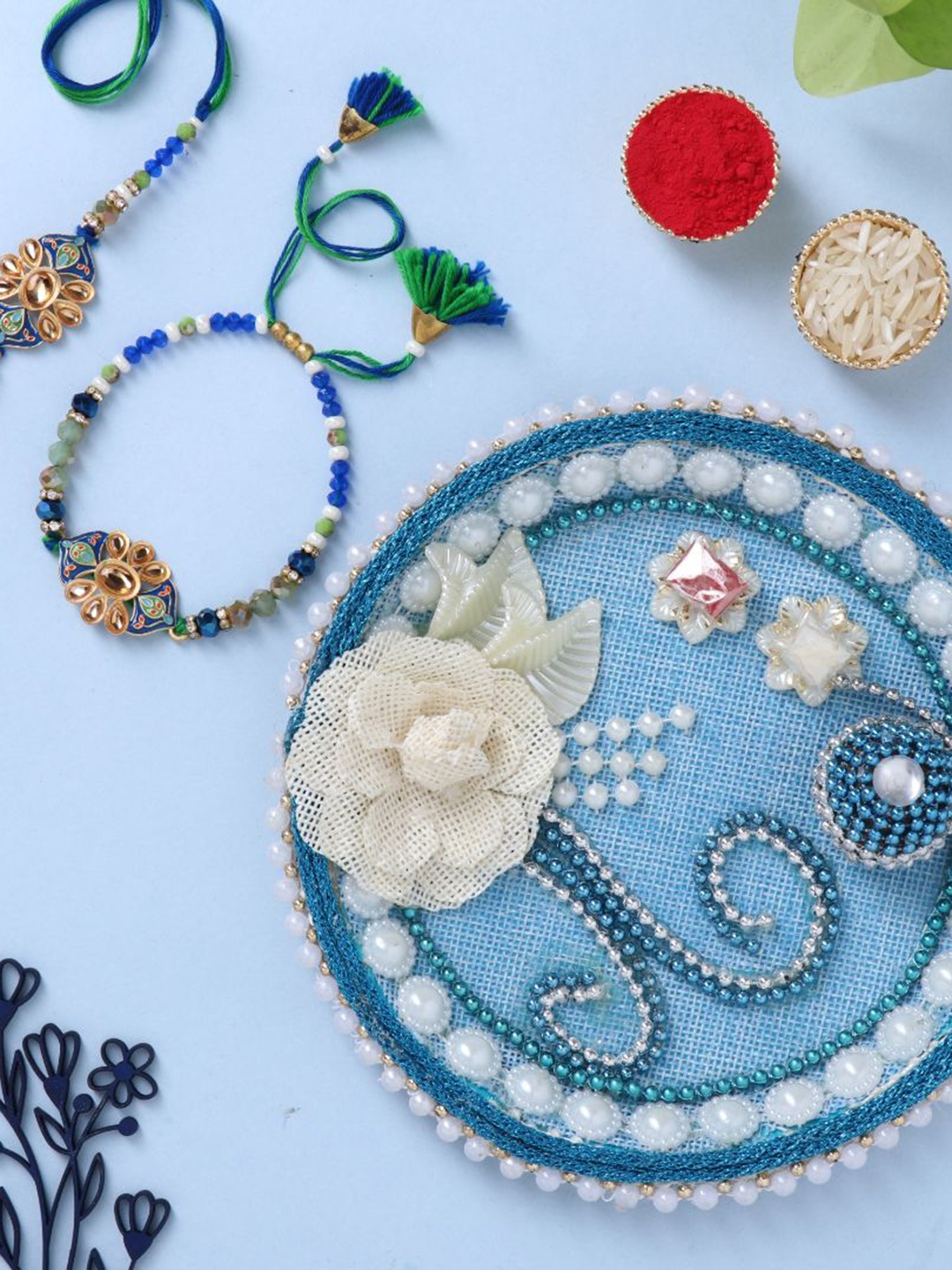 

Floweraura Set of 2 Bhaiya Bhabi Stone Studded Rakhi With Tika Thali, Blue