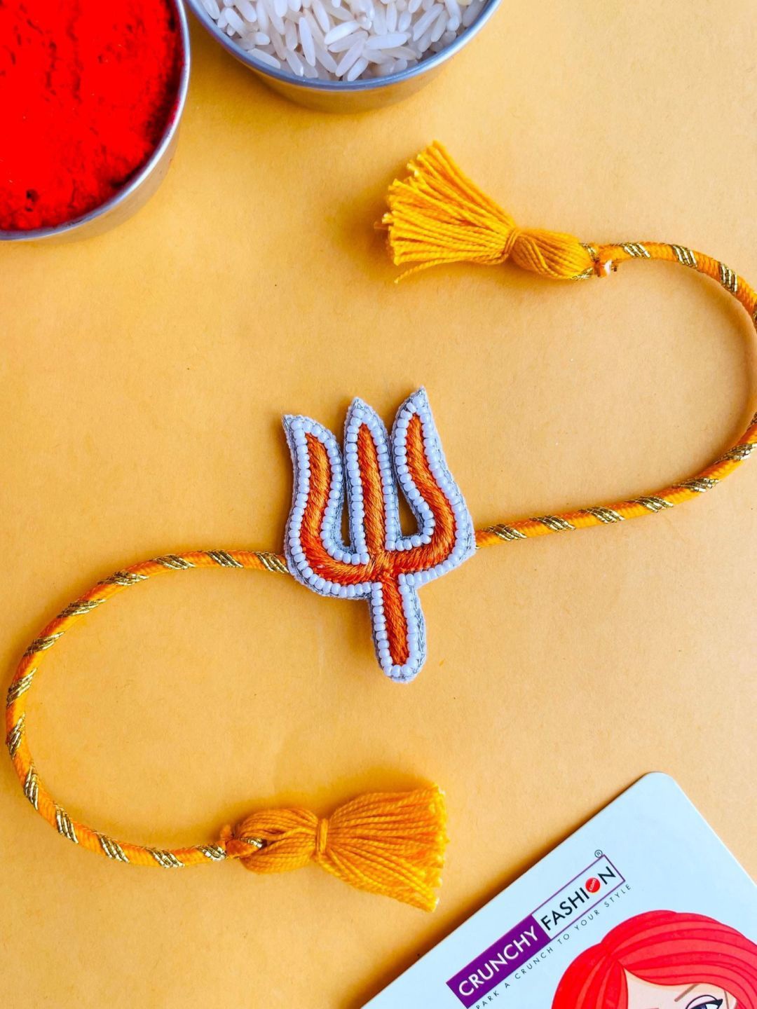 

Crunchy Fashion Trishul Thread Rakhi, Yellow