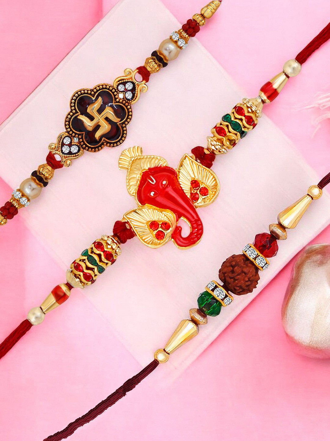 

Okos Set Of 3 Swastika Ganesha and Rudraksha Thread Rakhis, Gold
