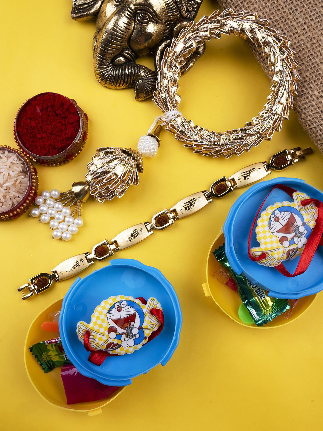 

StileAdda Set Of 3 Bhaiya Bhabhi & Doremon Rakhis With Roli Chawal, Gold