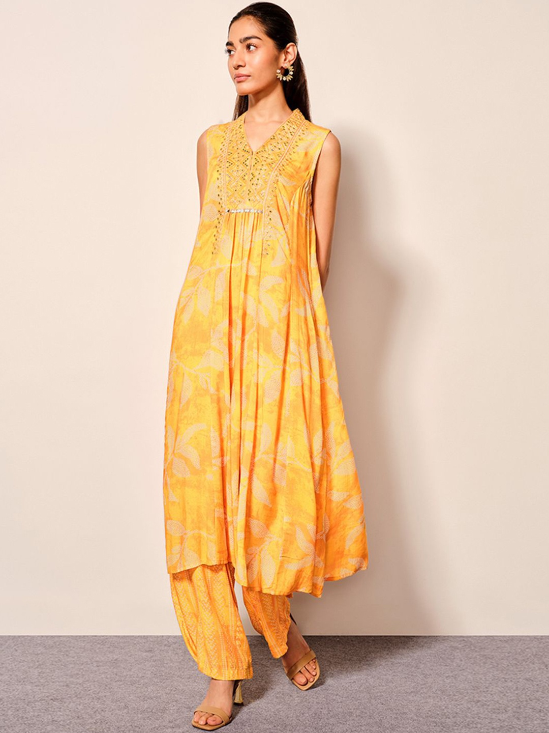

Global Desi Floral Printed V-Neck Mirror Work A-Line Kurta with Trousers, Mustard