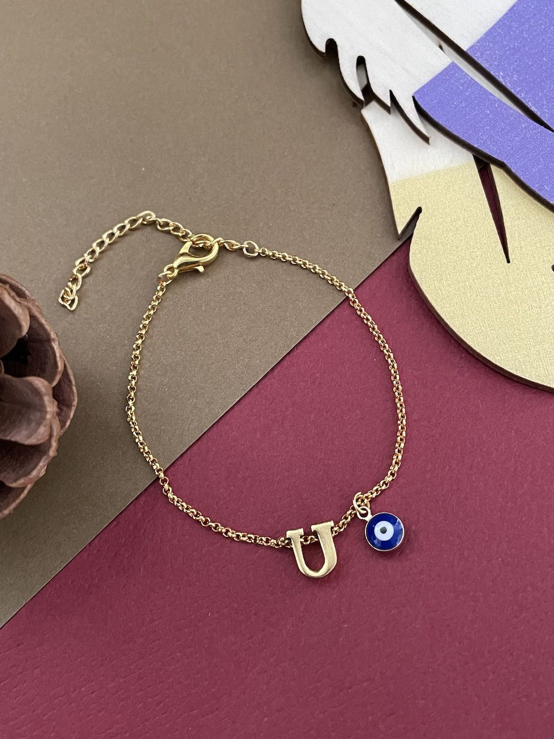 

Digital Dress Room U Letter Evil Eye Rakhi, Gold