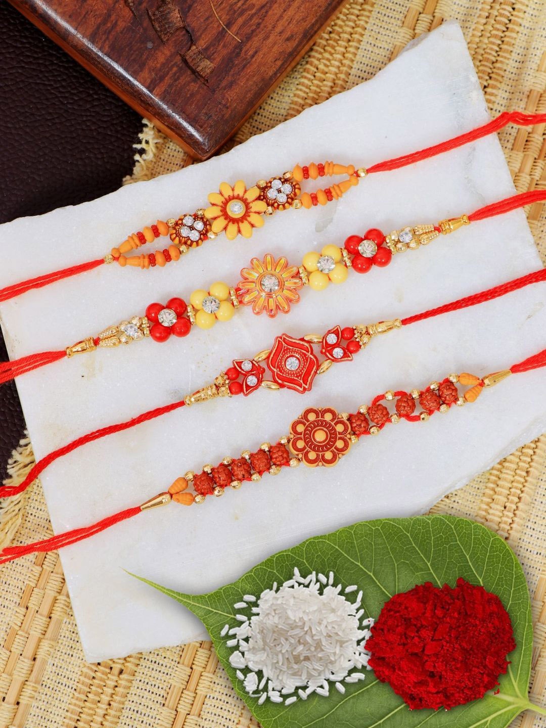 

Crunchy Fashion Set Of 4 Floral Thread Rakhi, Red