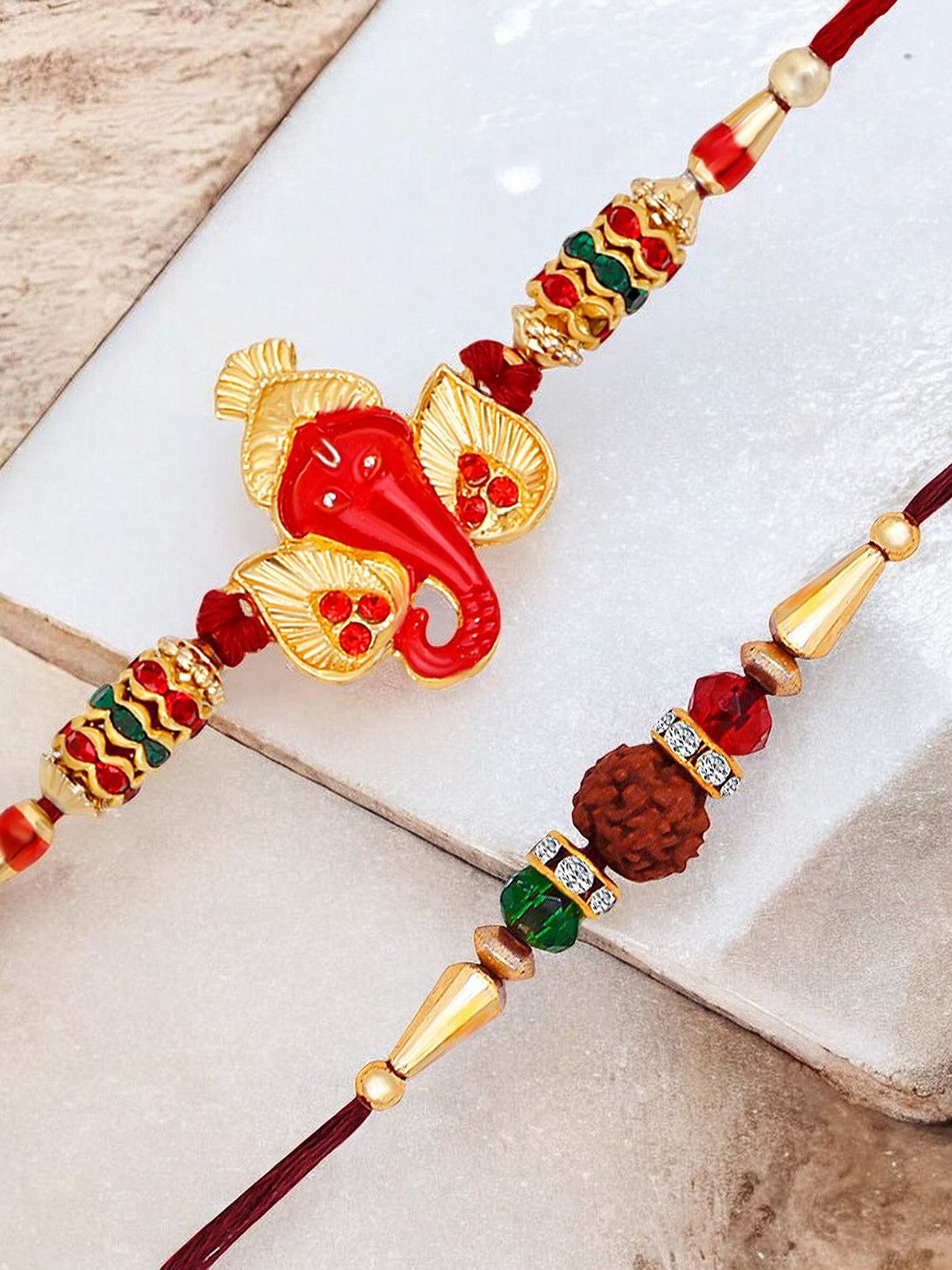 

Okos Set Of 2 Gold Plated Sidhivinayak Inspired Ganpati Thread Rakhi