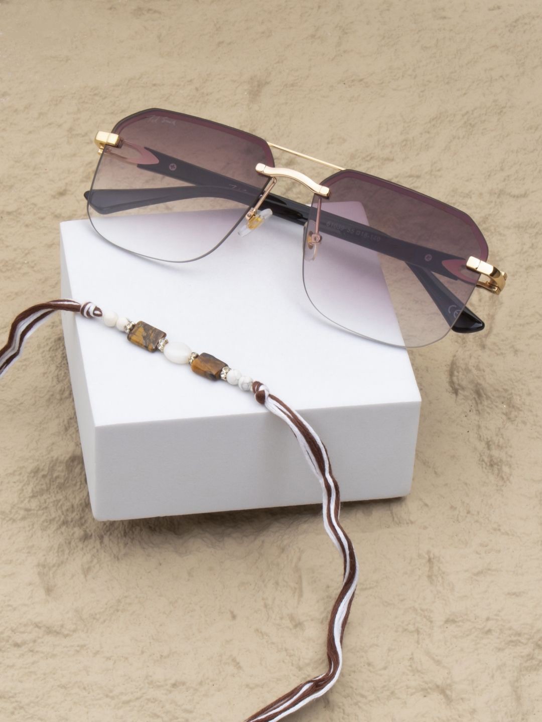 

Ted Smith 2-Pcs Rakhi With Sunglasses Gift Set, Gold