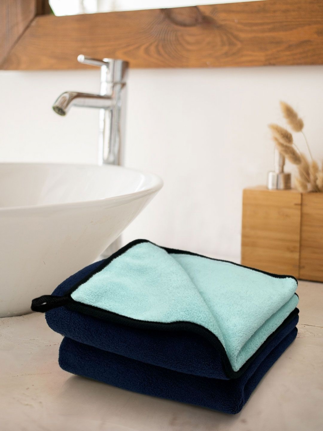 

Myntra Elegant Homes Warren Navy Blue & Green 2 Pieces Reversible 650 GSM Hand Towels