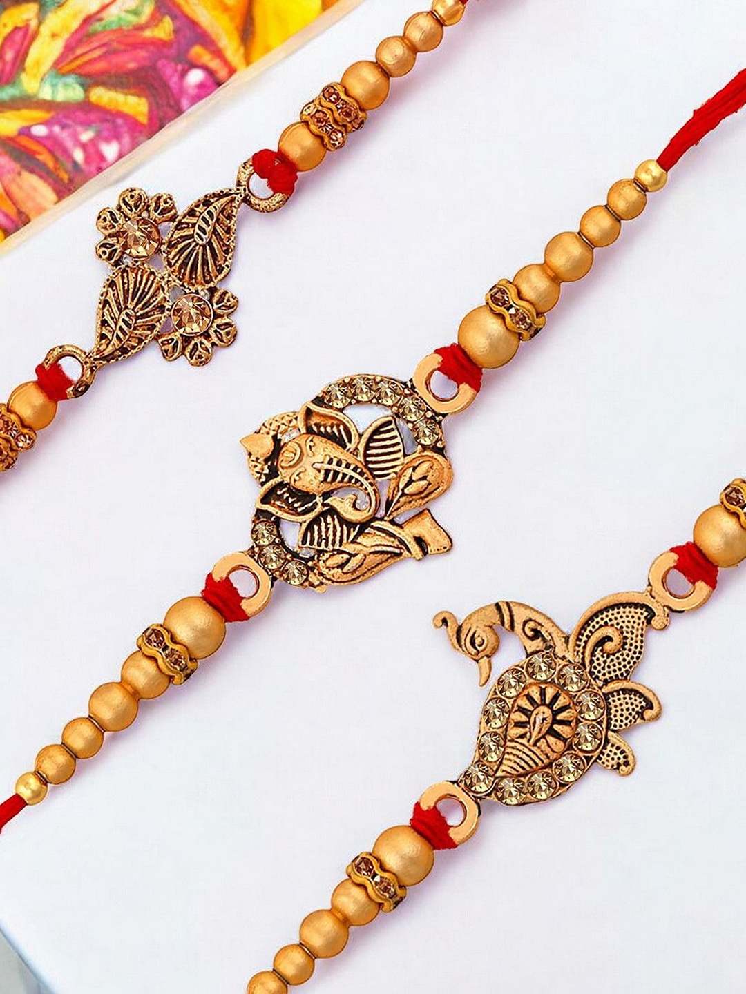 

Okos Set Of 3 Stones Studded Thread Rakhis, Gold