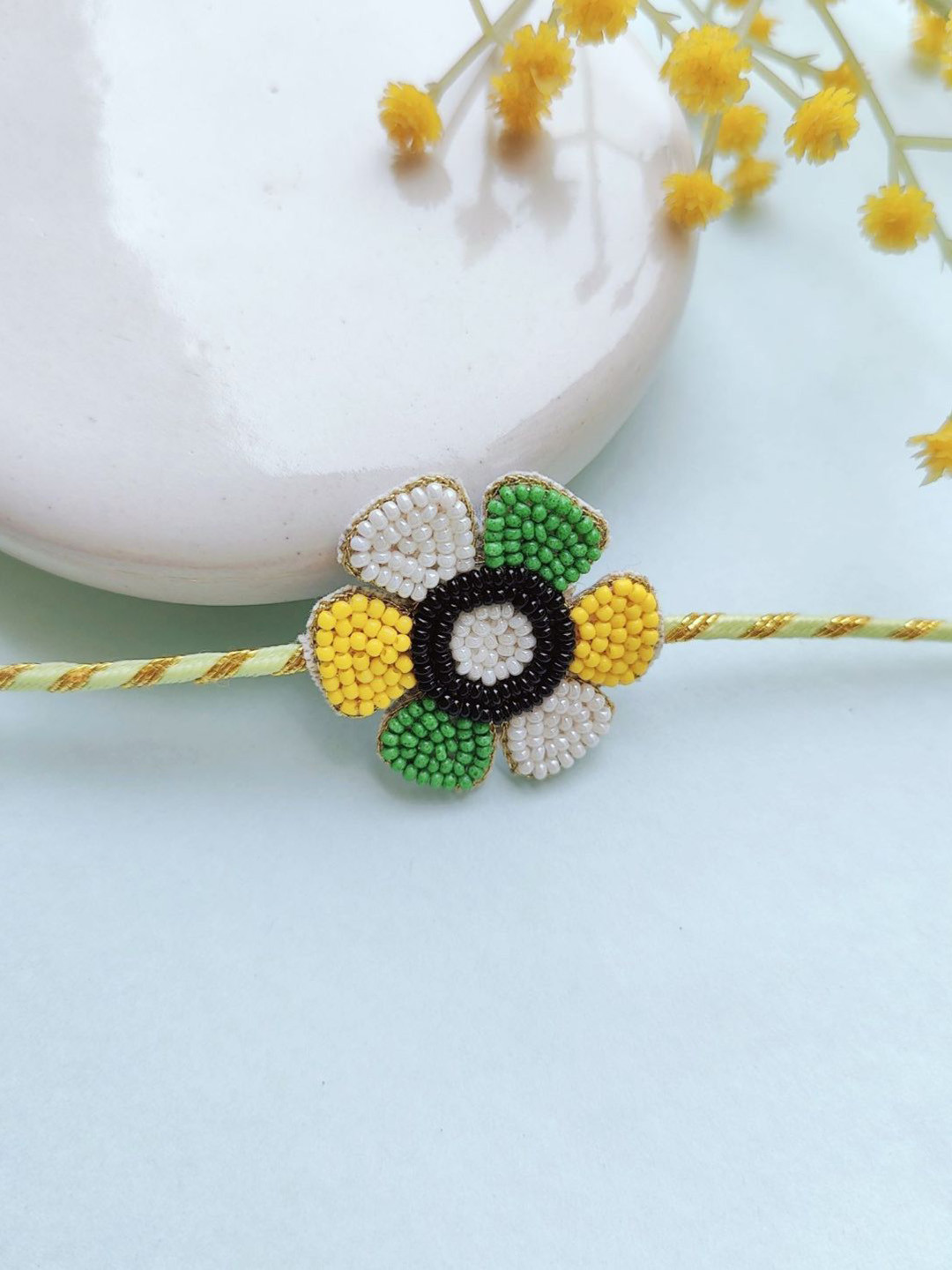 

Crunchy Fashion Flower Beaded Thread Rakhi, Green