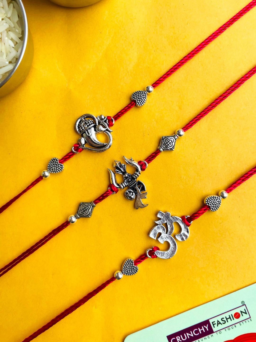 

Crunchy Fashion Set of 3 Om-Trishul-Ganpati Oxidised Thread Rakhis, Silver