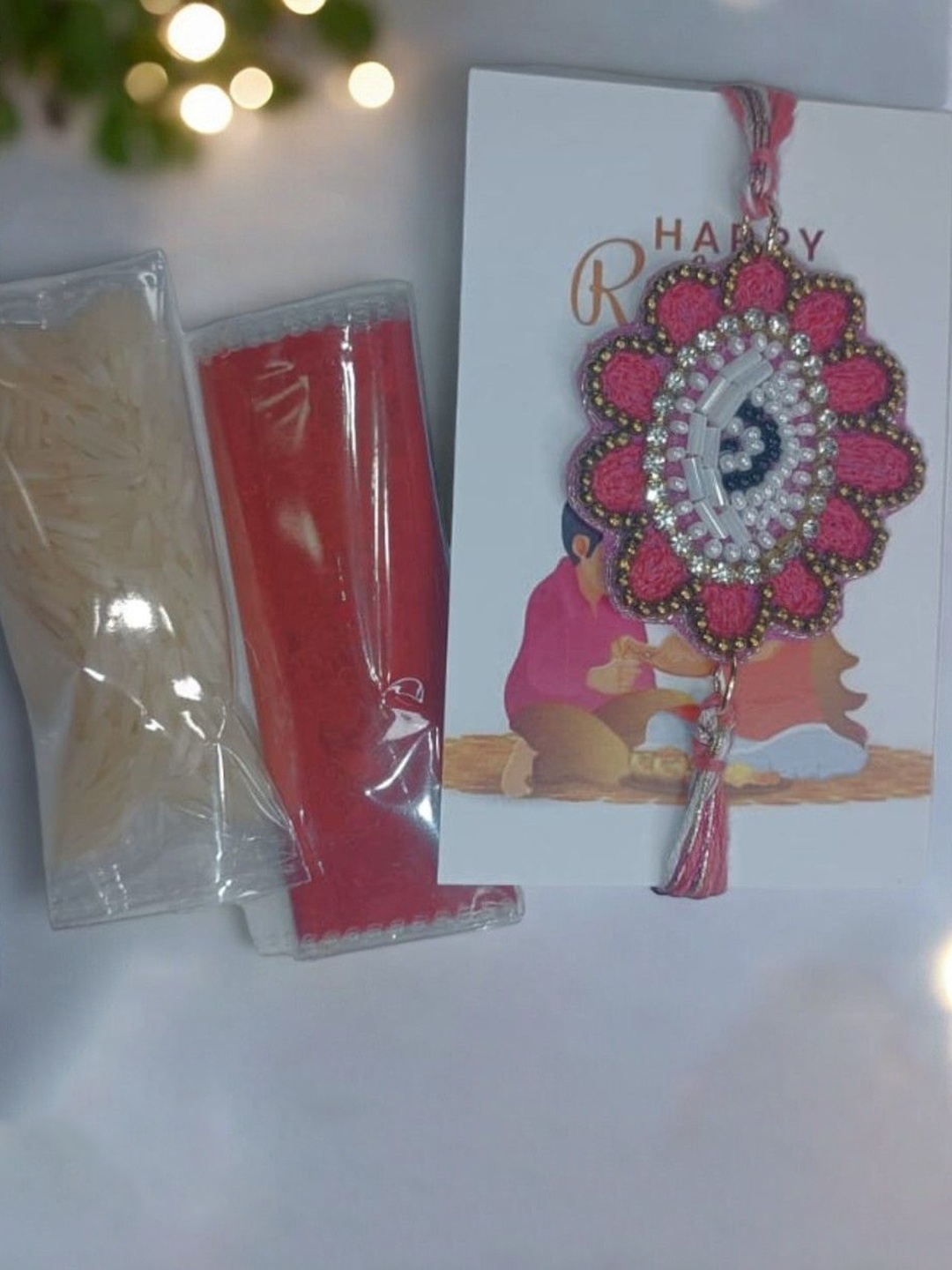 

PRIAANSHA CREATIONS Stone Studded & Beaded Thread Rakhi With Roli Chawal, Red