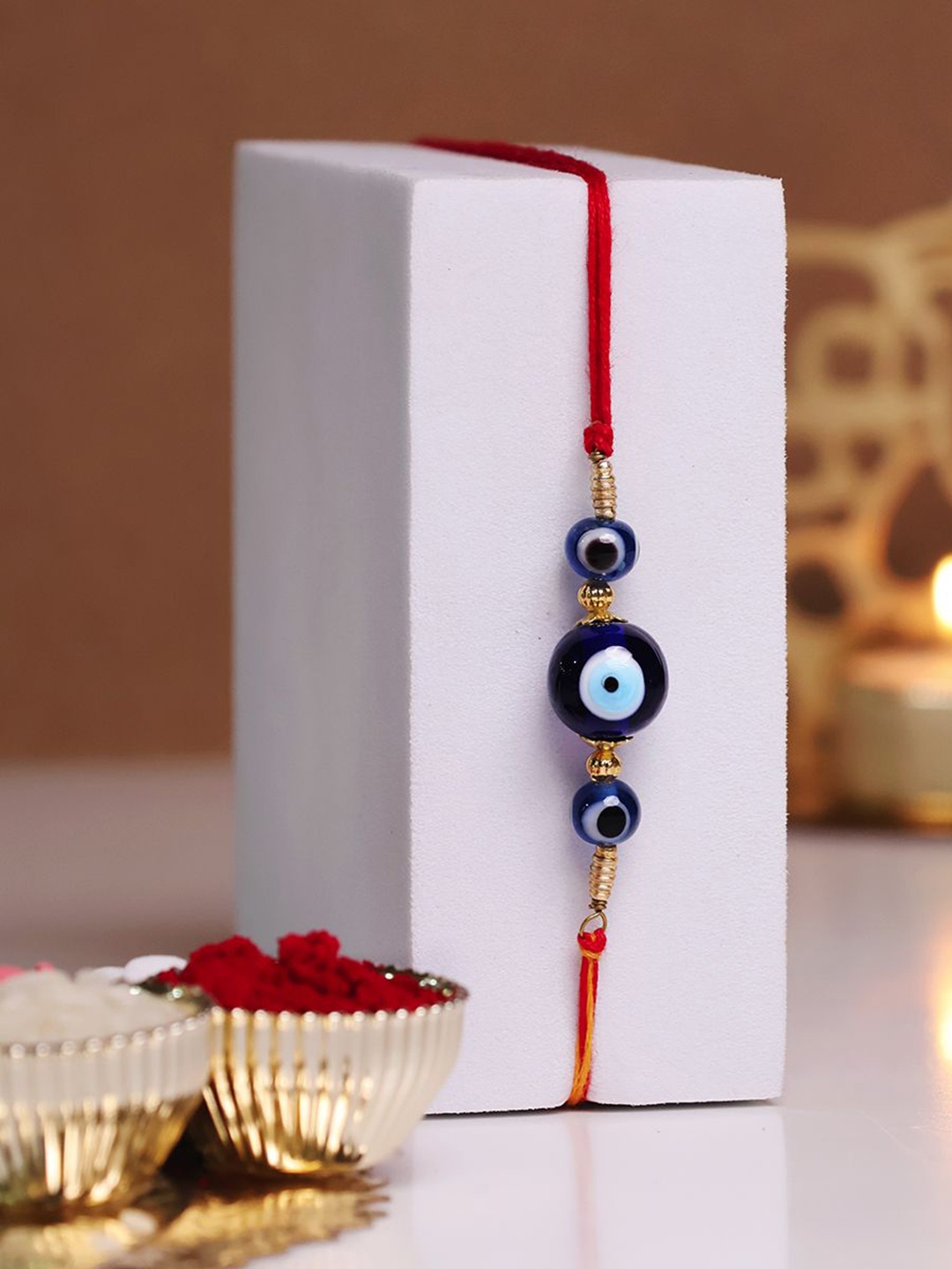 

Shubhanjali Evil Eye Beaded Thread Rakhi With Greeting Card & Roli Chawal, Blue
