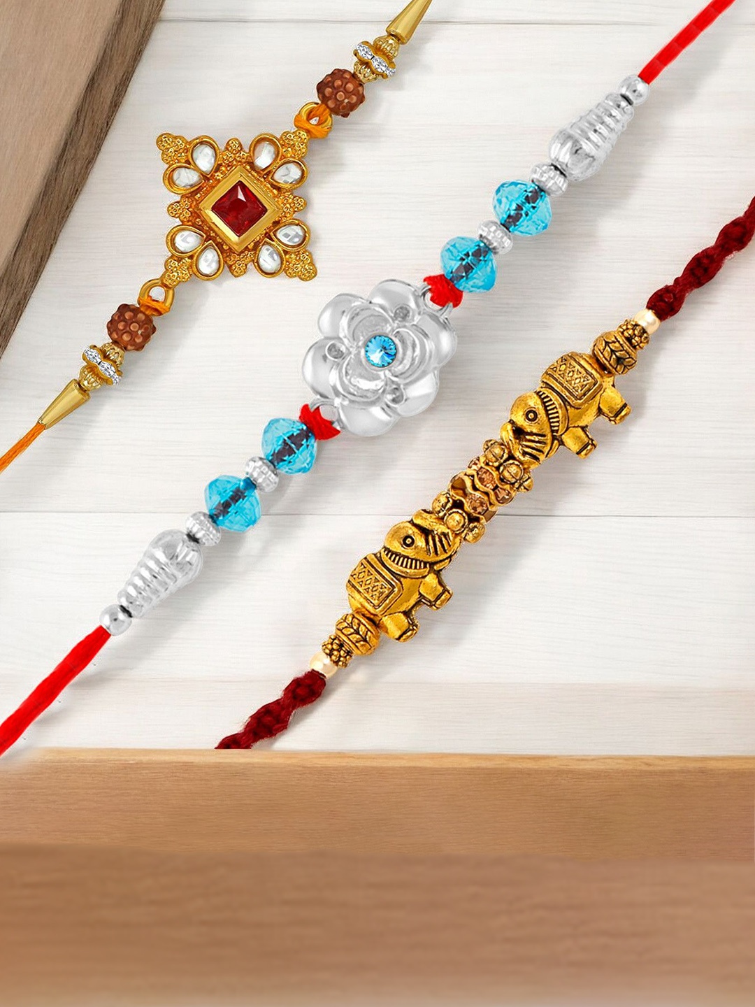 

Okos Set Of 3 Gold And Rhodium Plated Thread Rakhis