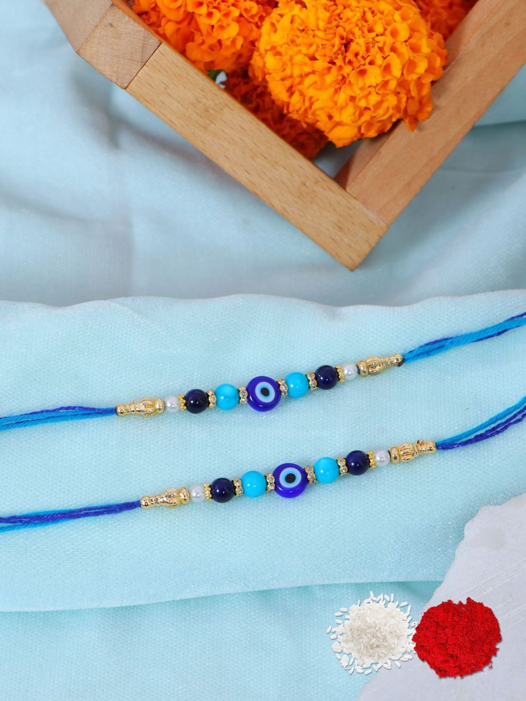 

Crunchy Fashion Set Of 2 Evil Eye Thread Rakhi With Roli Chawal, Blue