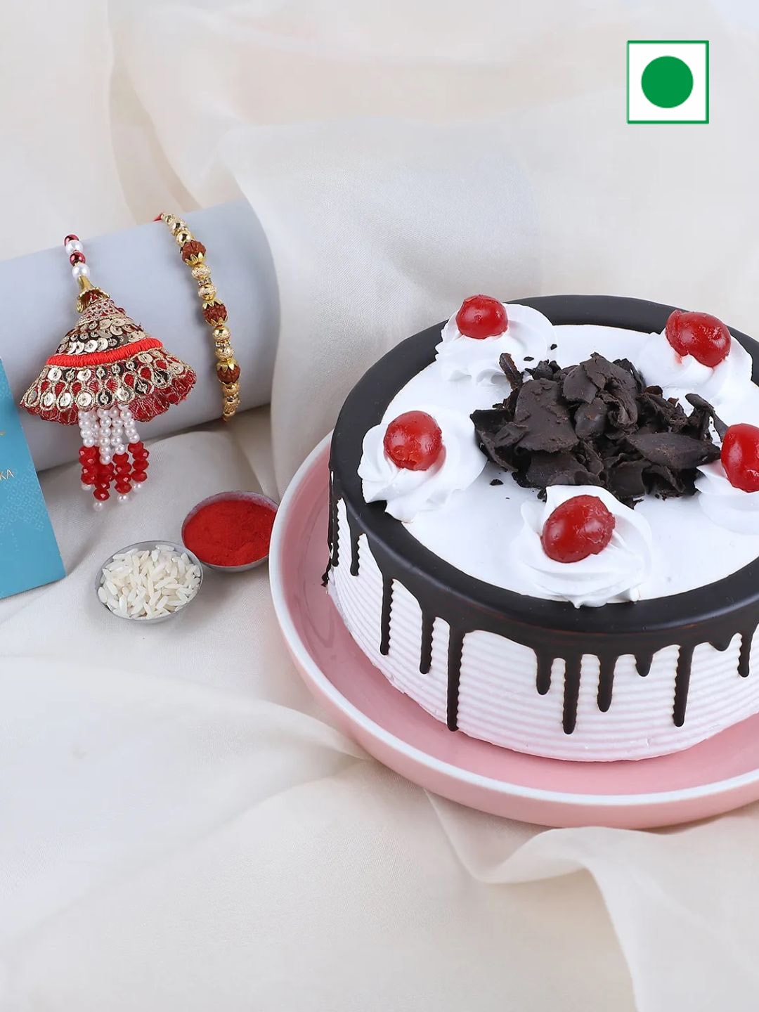 

fnp Sneh lumba Rakhi With Cake & Roli Chawal, Red