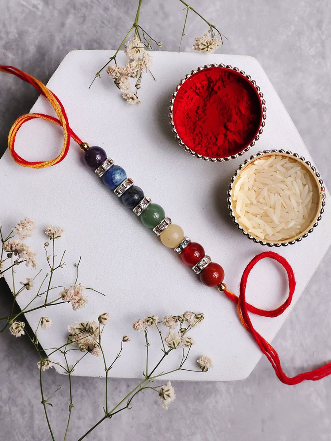 

Shubhanjali 7 Chakra Ring Beaded Thread Rakhis With Roli Chawal & Greeting Card, Red