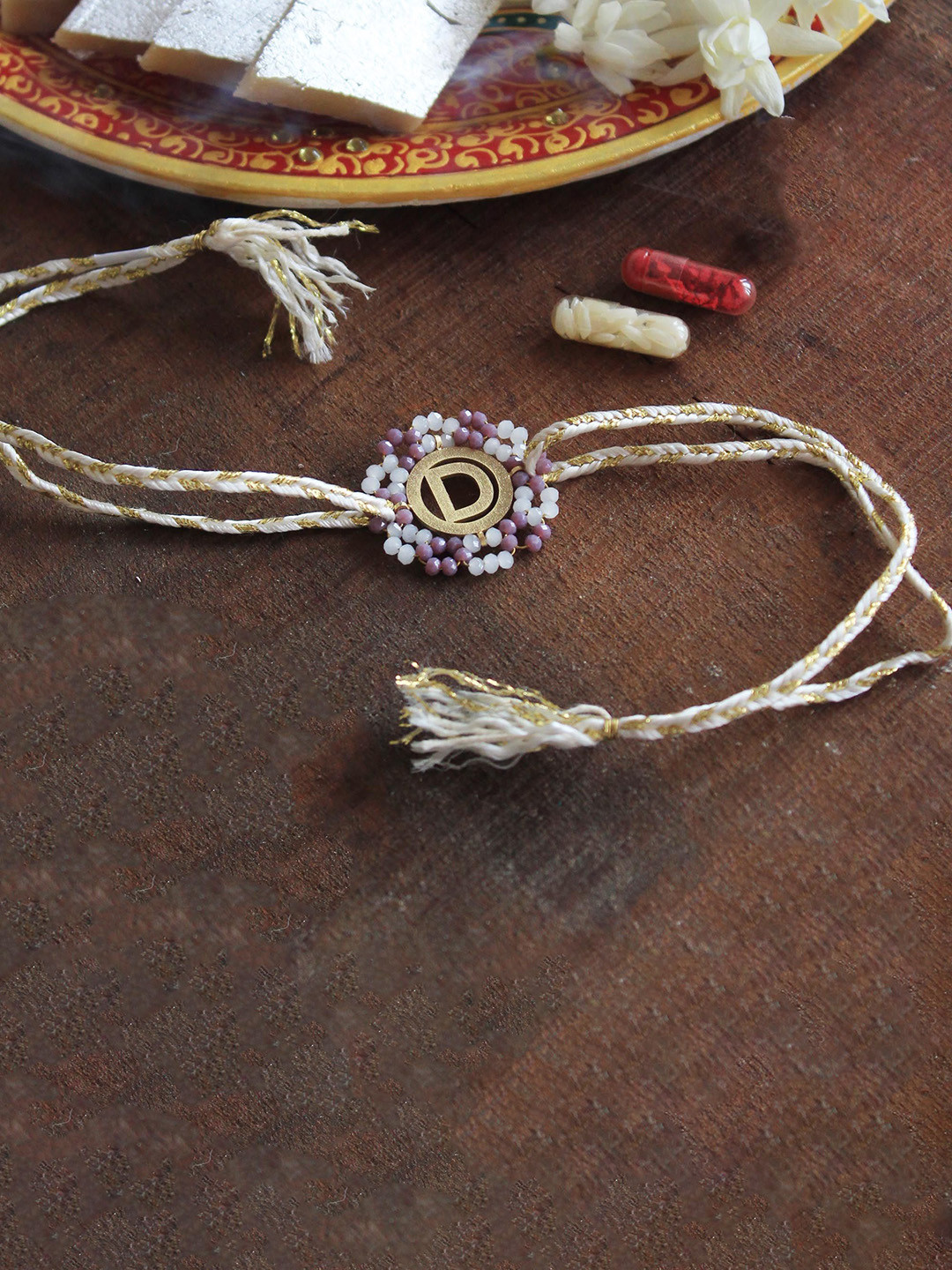 

BeAbhika "H" Initial Thread Rakhi with Roli Chawal Capsules, White