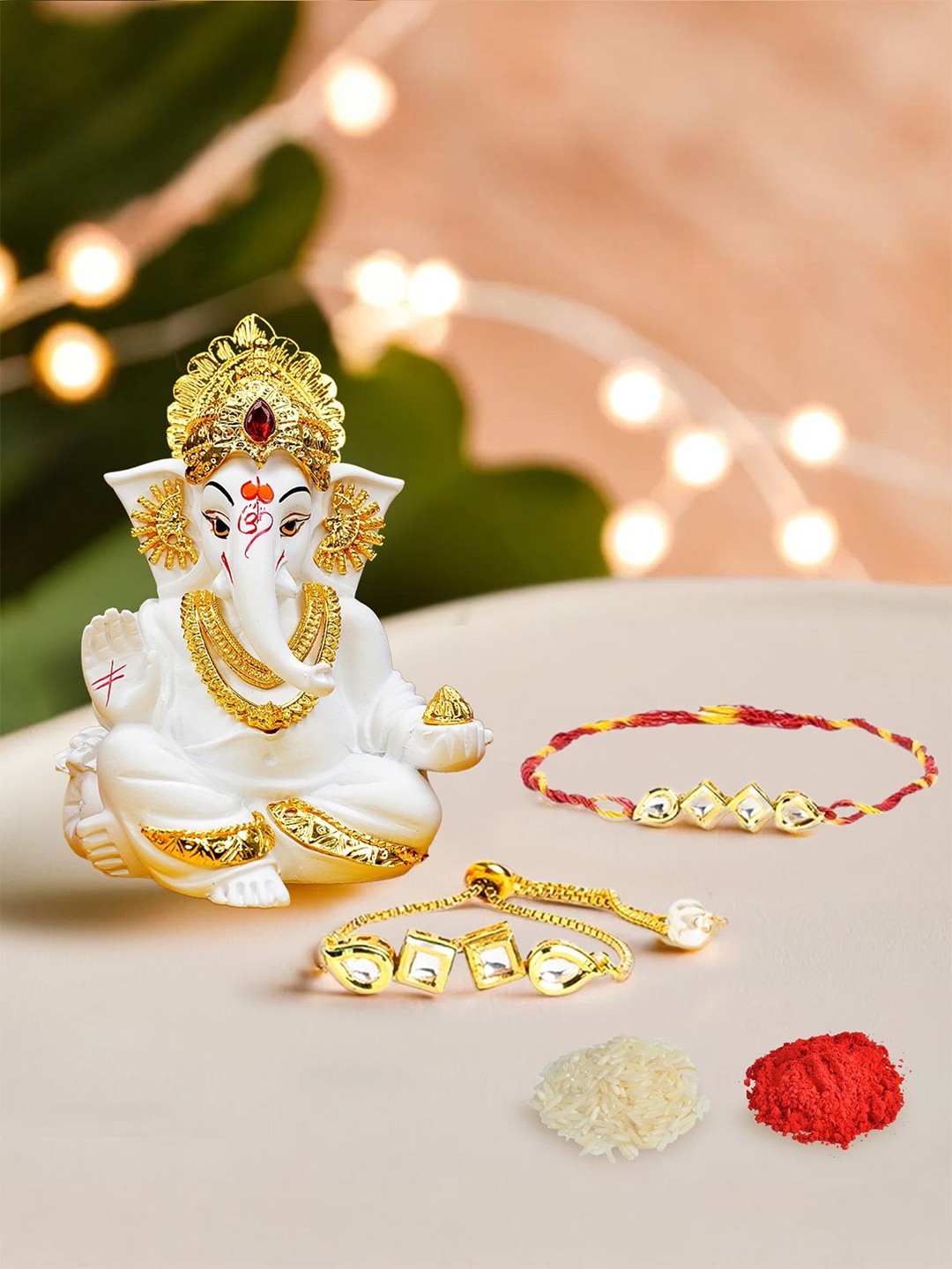 

Ekhasa Set Of 2 Bhaiya Bhabhi Rakhi With Ganesha Idol & Roli Chawal Rakhi Gift Set, Gold