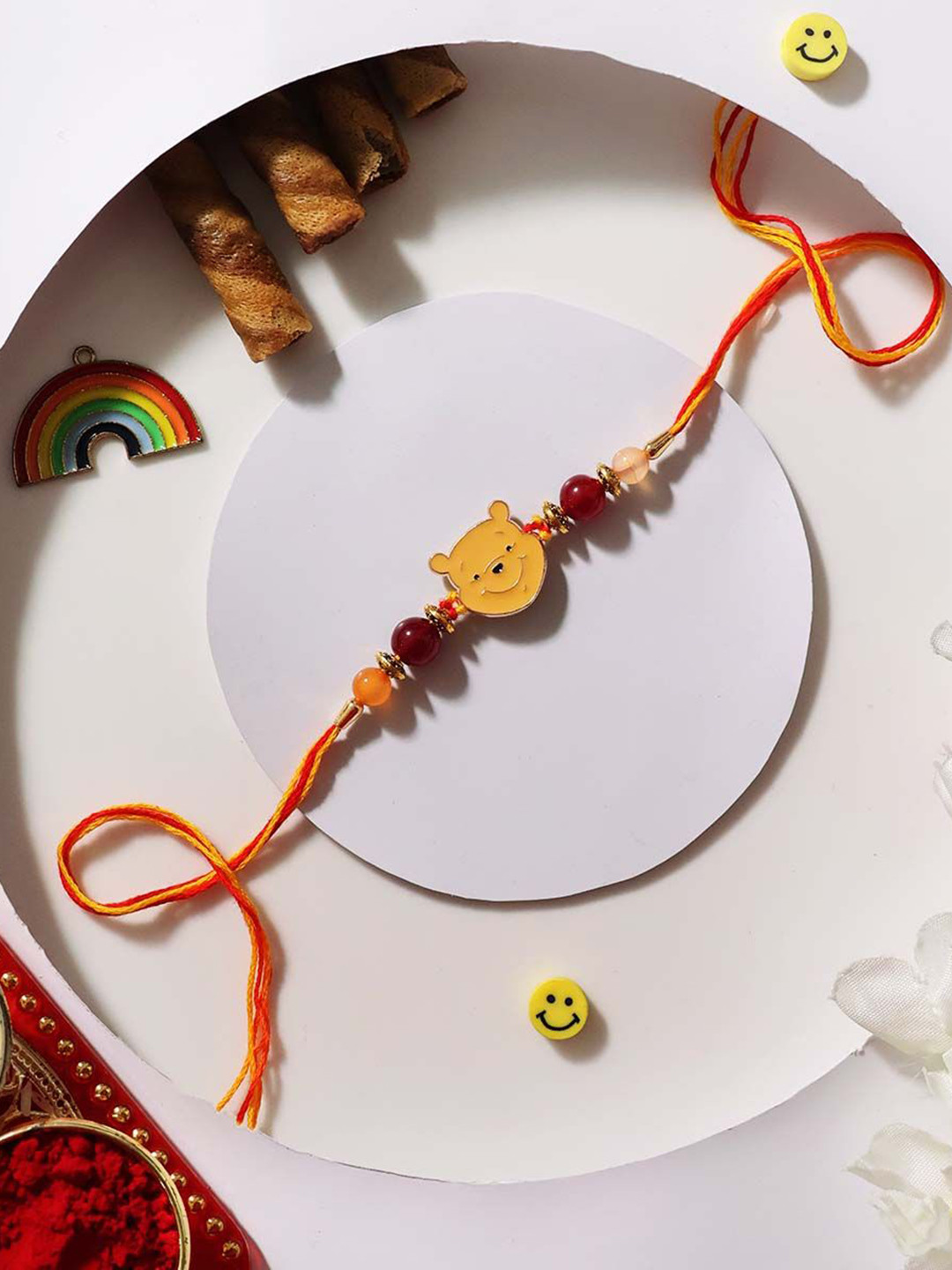 

Shubhanjali Kids Set Of 2 Winnie The Pooh Rakhis With Roli Chawal & Greeting Card, Yellow