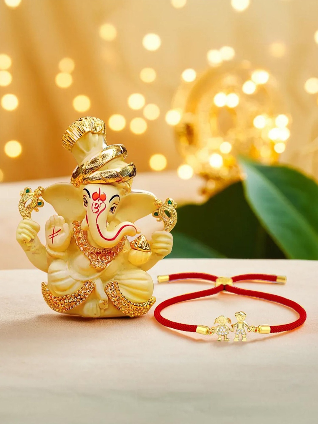 

Ekhasa Brother Sister Rakhi Gift Set with Ganesha Idol, Gold