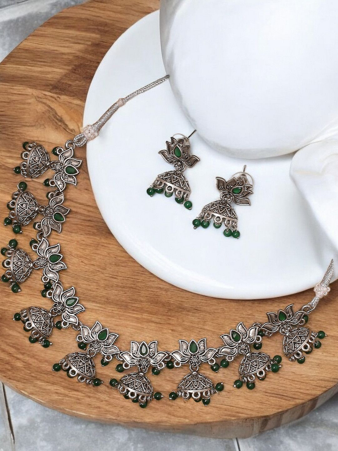 

Sangria Silver-Toned Stone Studded & Beaded Louts Design Oxidised Jewellery Set