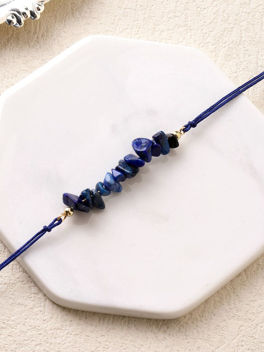 

SALTY Gemstone Of Spiritual Growth Thread Rakhi, Navy blue