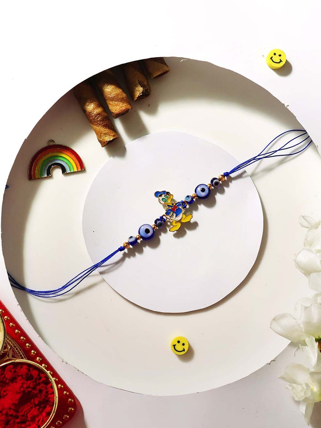 

Shubhanjali Donald Duck Evil Eye Beaded Thread Rakhi, Blue