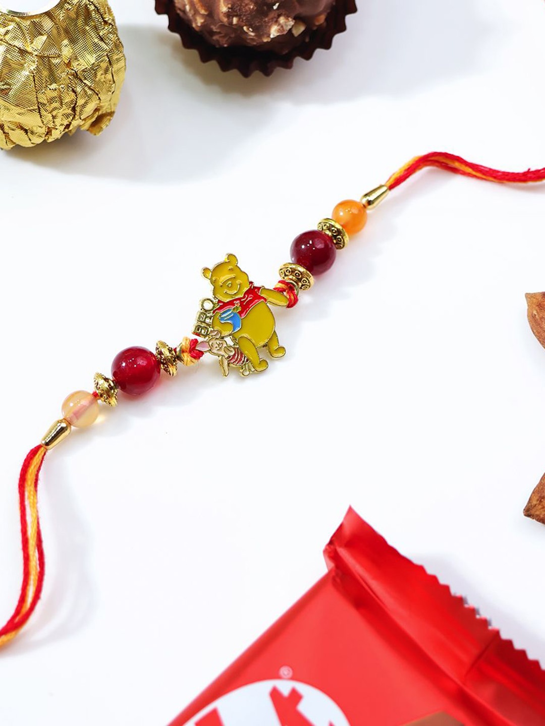 

Shubhanjali Kids Winnie The Pooh Bro Motivation Rakhi With Roli Chawal & Greeting Card, Red