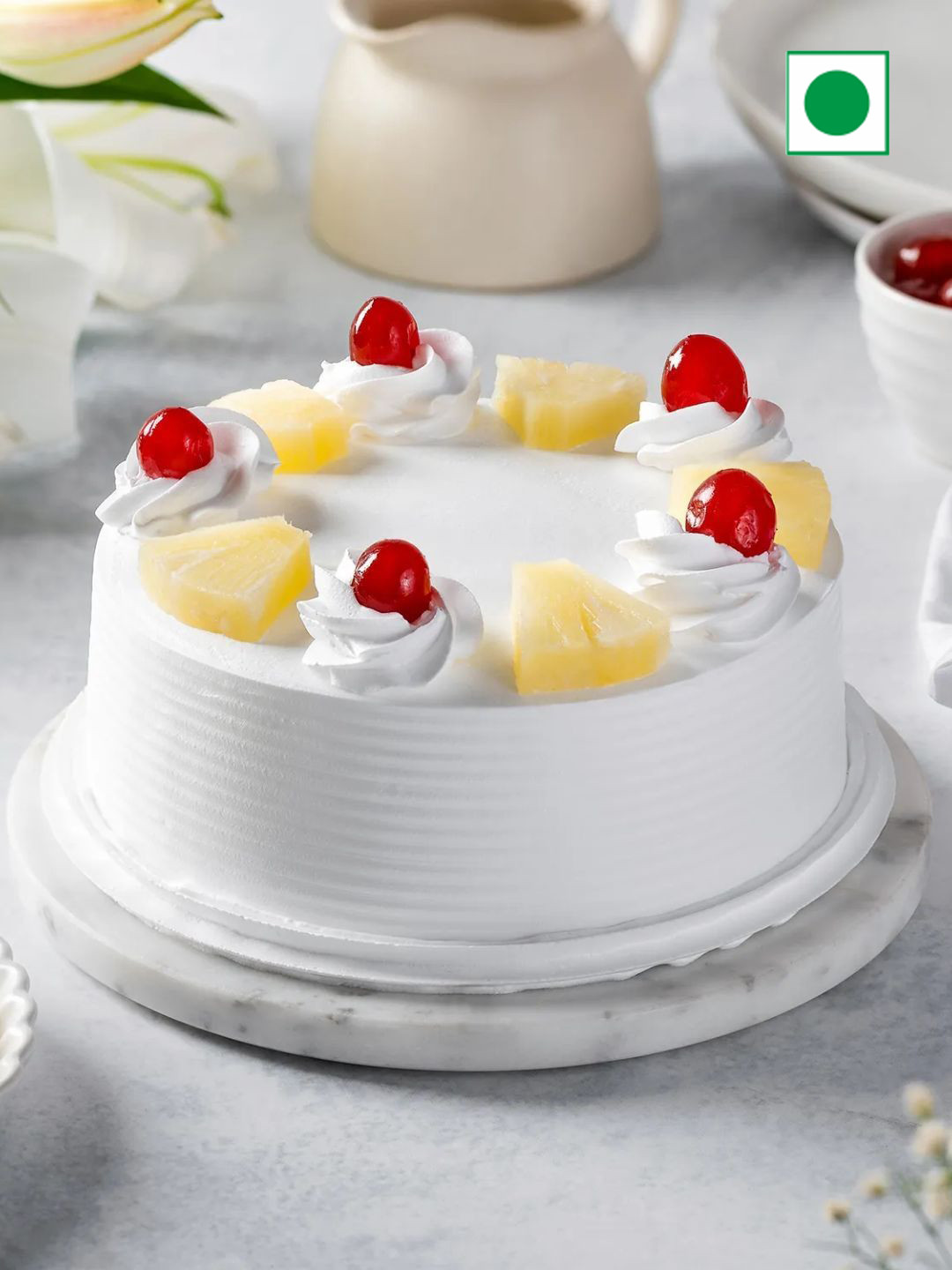 

fnp Tassel Rakhi & Pineapple Cake With Roli Chawal Gift Set, Red